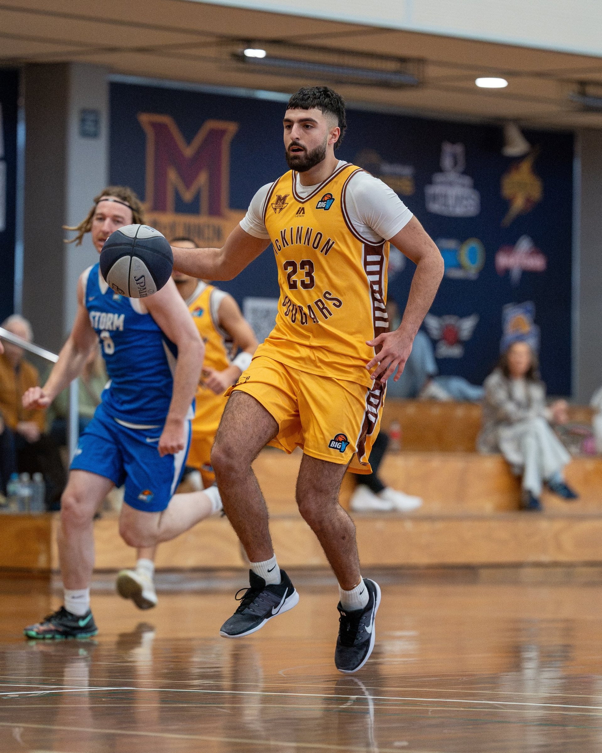 McKinnon senior player bringing the ball up in the gold strip