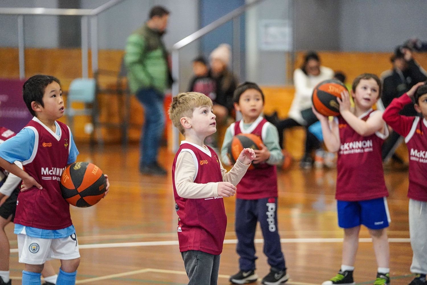 Young McKinnon players with basketballs at Aussie Hoops