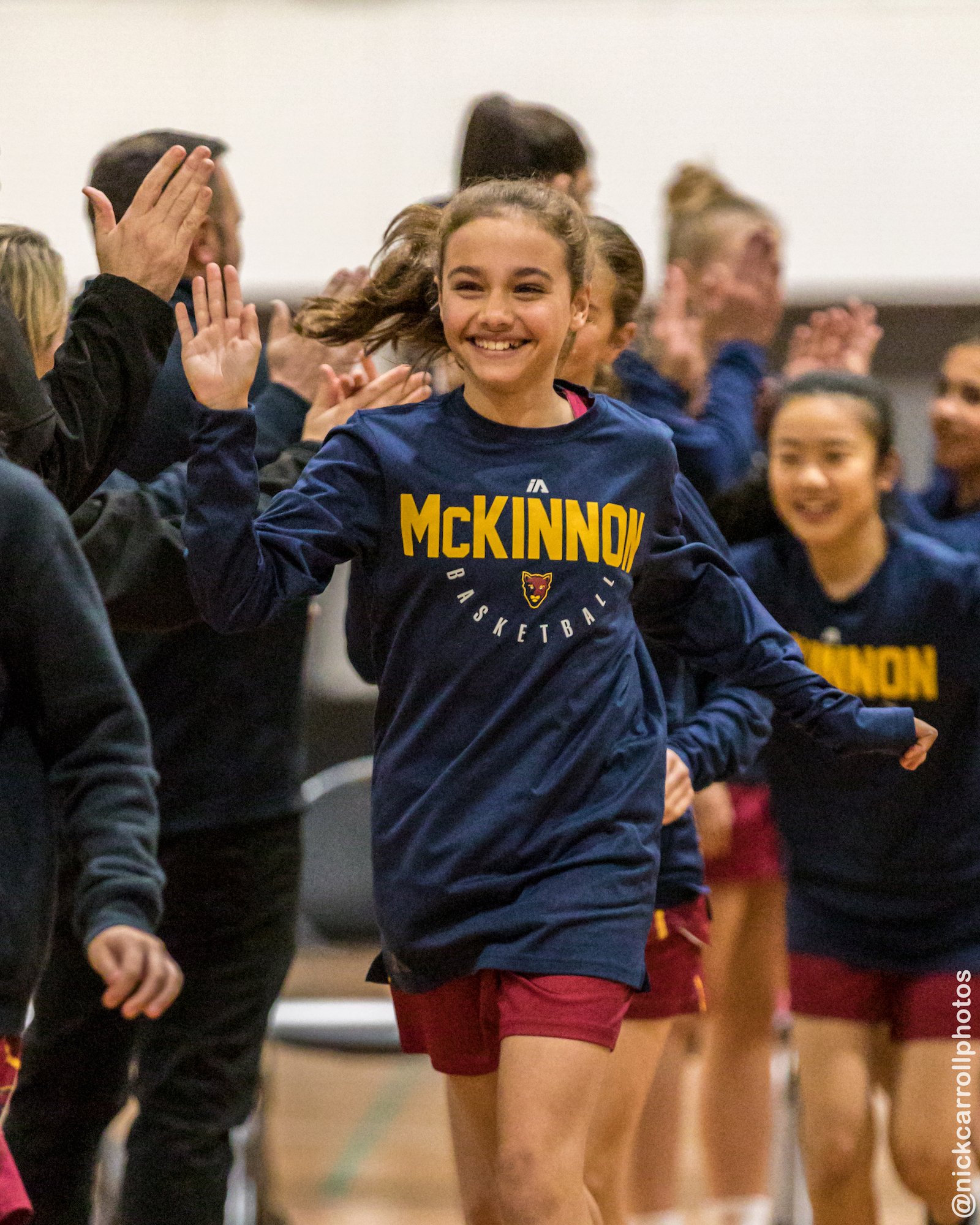 McKinnon junior players celebrating on court