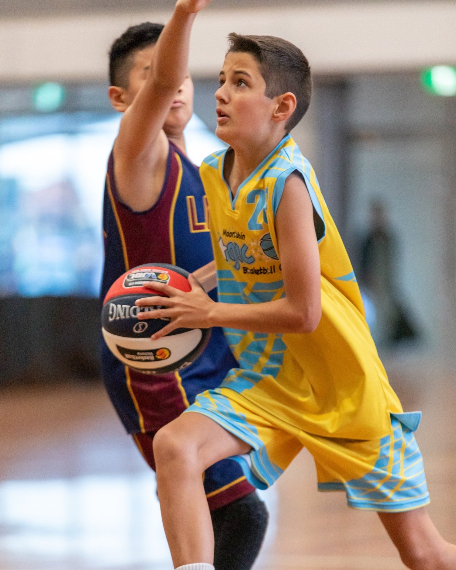 A junior player going up for a shot